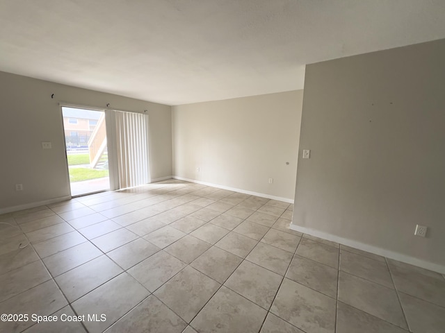 151 Ulster Ln, Melbourne, FL 32935 - spare room with baseboards and light tile patterned floors
