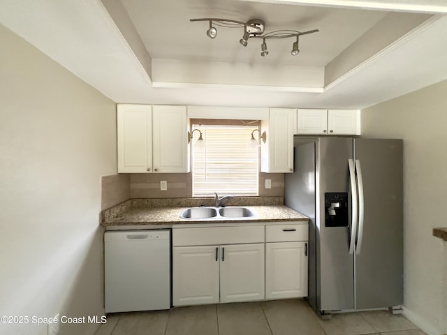 151 Ulster Ln, Melbourne, FL 32935 - kitchen with stainless steel fridge, a sink, dishwasher, white cabinetry, and light tile patterned floors