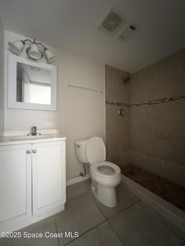 151 Ulster Ln, Melbourne, FL 32935 - bathroom with visible vents, a tile shower, toilet, and vanity