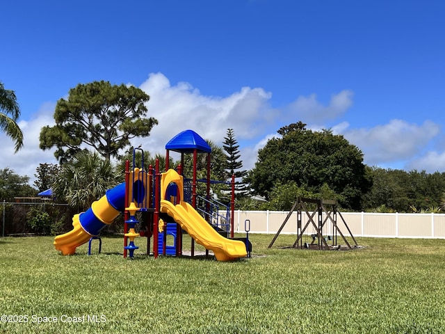 151 Ulster Ln, Melbourne, FL 32935 - community jungle gym with a lawn and fence