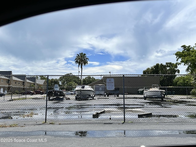151 Ulster Ln, Melbourne, FL 32935 - exterior space with uncovered parking and fence