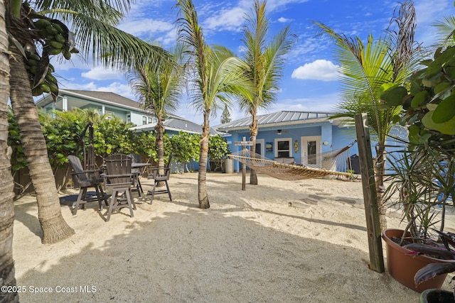 131 Harding Avenue 131& 129, Cocoa Beach, FL 32931 - view of yard with a patio