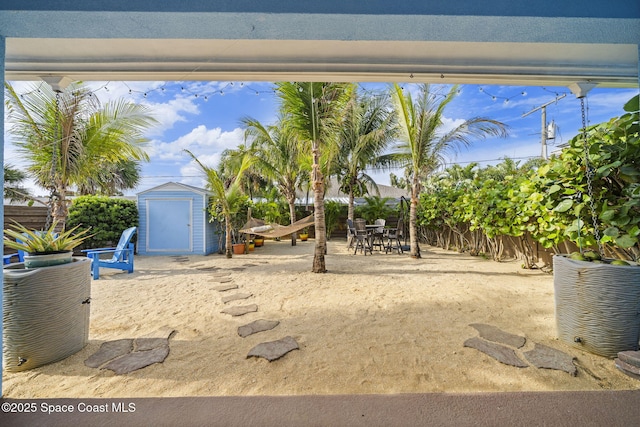 131 Harding Avenue 131& 129, Cocoa Beach, FL 32931 - fenced backyard featuring a patio and outdoor dining space
