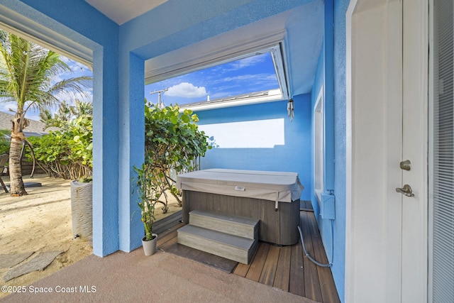 131 Harding Avenue 131& 129, Cocoa Beach, FL 32931 - exterior space with a hot tub and stucco siding