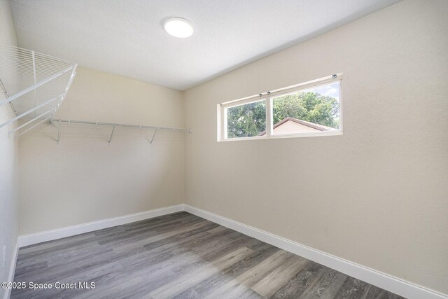 1107 Woodlawn Rd, Rockledge, FL 32955 - spacious closet with wood finished floors