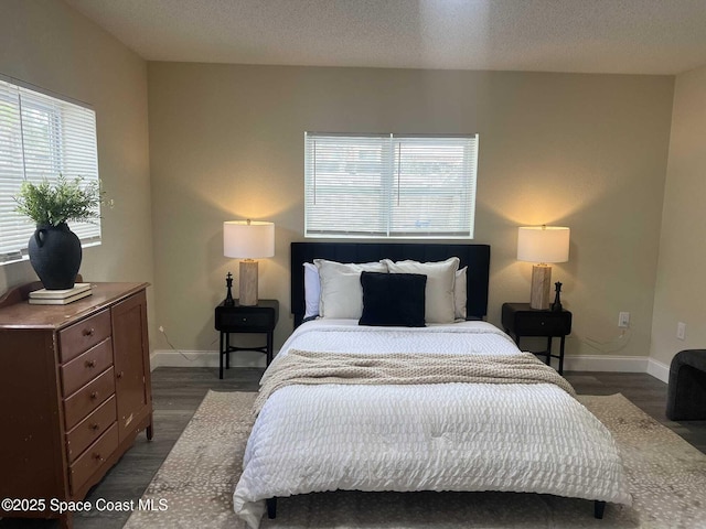 1107 Woodlawn Rd, Rockledge, FL 32955 - bedroom featuring wood finished floors and baseboards