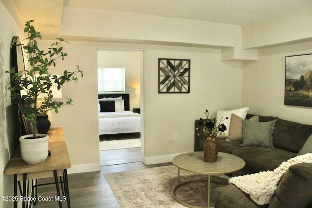 1107 Woodlawn Rd, Rockledge, FL 32955 - living room featuring baseboards and wood finished floors
