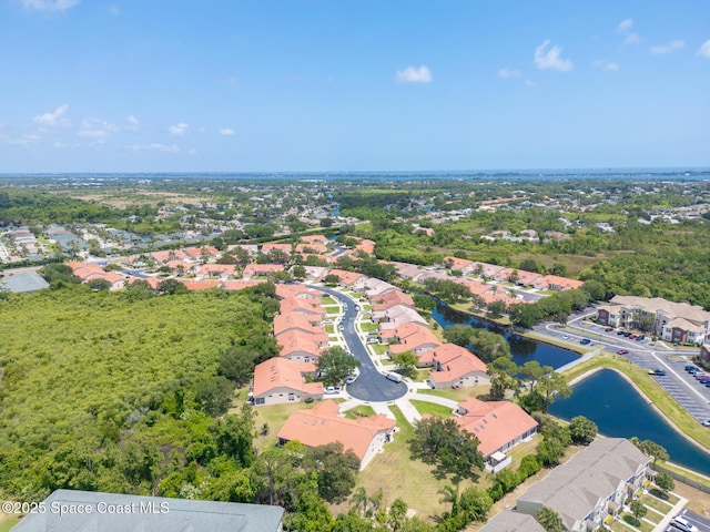 bird's eye view featuring a residential view and a water view