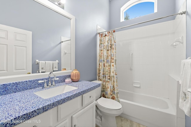 full bathroom featuring shower / bathtub combination with curtain, vanity, and toilet