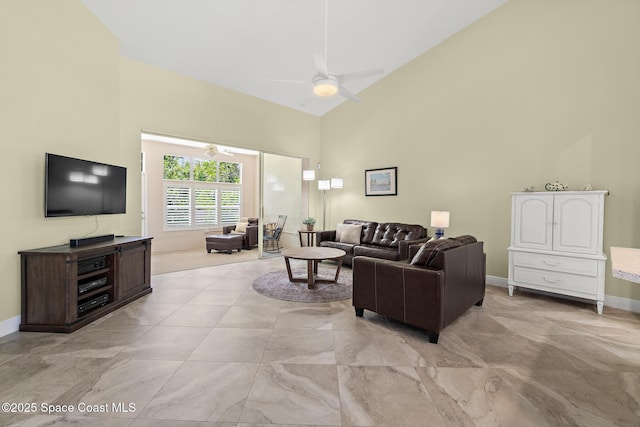 living room featuring baseboards, high vaulted ceiling, a ceiling fan, and marble finish floor
