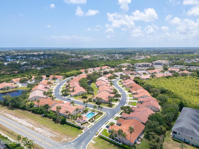 bird's eye view with a residential view and a water view