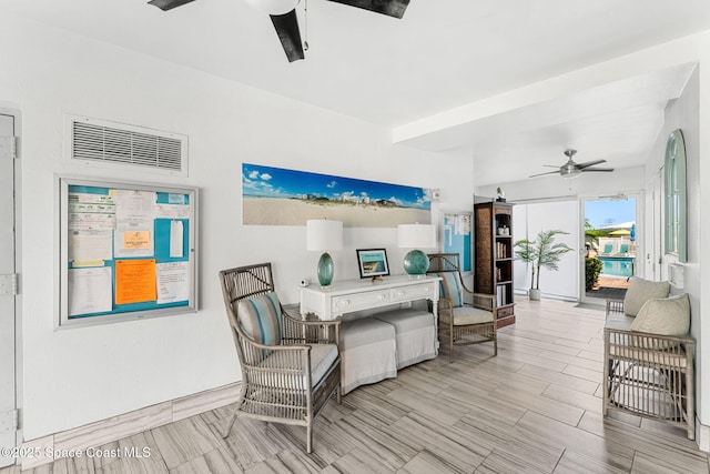 living room featuring ceiling fan