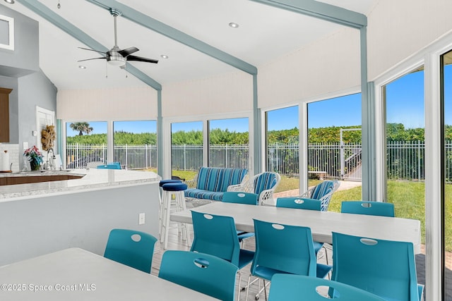 sunroom with plenty of natural light and a sink