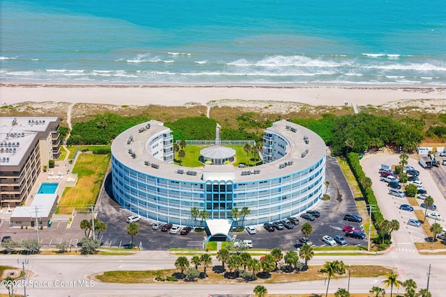 aerial view of extended coastline and apartment complex