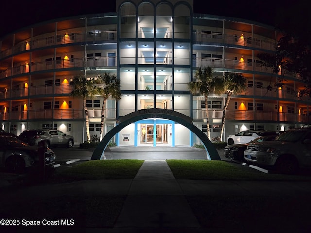 property at twilight with uncovered parking