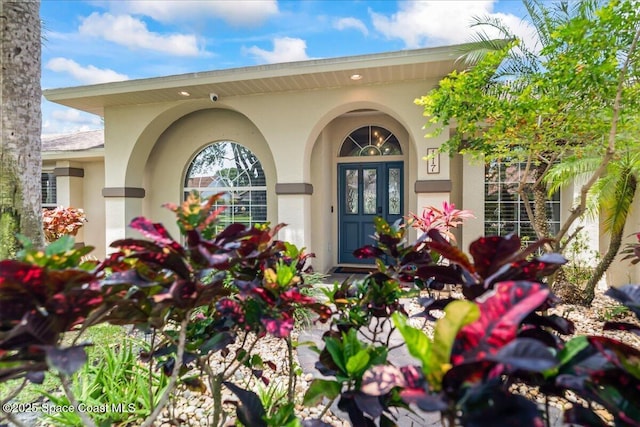 117 Windward Way, Indian Harbour Beach, FL 32937 - property entrance featuring stucco siding
