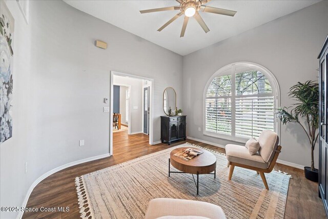 117 Windward Way, Indian Harbour Beach, FL 32937 - living area with wood finished floors, a ceiling fan, and baseboards