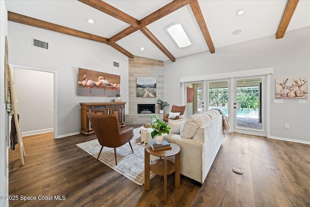 117 Windward Way, Indian Harbour Beach, FL 32937 - living room featuring visible vents, dark wood-style floors, baseboards, beam ceiling, and a tile fireplace