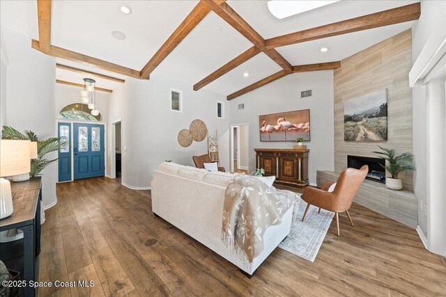 117 Windward Way, Indian Harbour Beach, FL 32937 - living room with beamed ceiling, recessed lighting, dark wood-style flooring, high vaulted ceiling, and baseboards