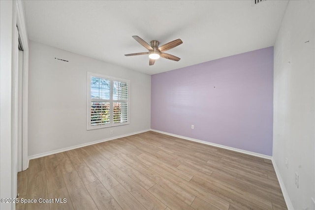 117 Windward Way, Indian Harbour Beach, FL 32937 - unfurnished room with light wood finished floors, a ceiling fan, and baseboards
