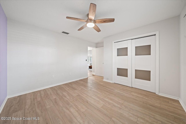 117 Windward Way, Indian Harbour Beach, FL 32937 - unfurnished bedroom featuring light wood-style floors, visible vents, a closet, baseboards, and a ceiling fan