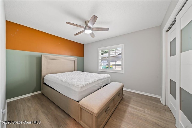 117 Windward Way, Indian Harbour Beach, FL 32937 - bedroom with wood finished floors, a ceiling fan, and baseboards
