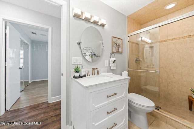 117 Windward Way, Indian Harbour Beach, FL 32937 - full bathroom with toilet, visible vents, a shower stall, and vanity