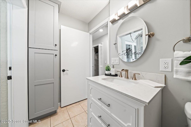 117 Windward Way, Indian Harbour Beach, FL 32937 - bathroom with toilet, tile patterned flooring, and vanity