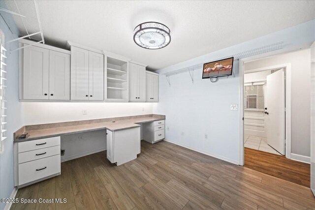 117 Windward Way, Indian Harbour Beach, FL 32937 - unfurnished office with dark wood-type flooring and baseboards