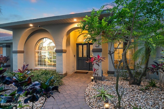 117 Windward Way, Indian Harbour Beach, FL 32937 - property entrance with stucco siding