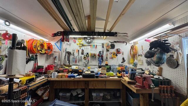 miscellaneous room featuring a workshop area
