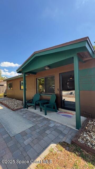 rear view of house with a patio