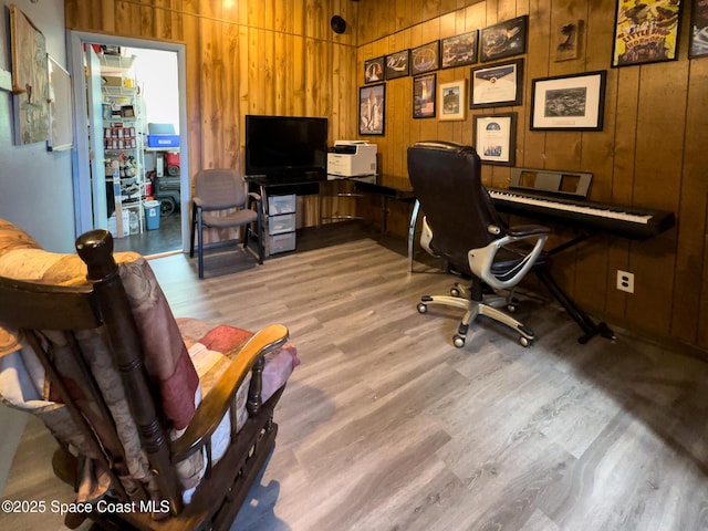 office space with wooden walls and wood finished floors