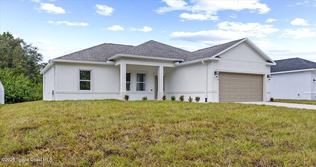 view of front of home with driveway, an attached garage, a shingled roof, a front yard, and stucco siding