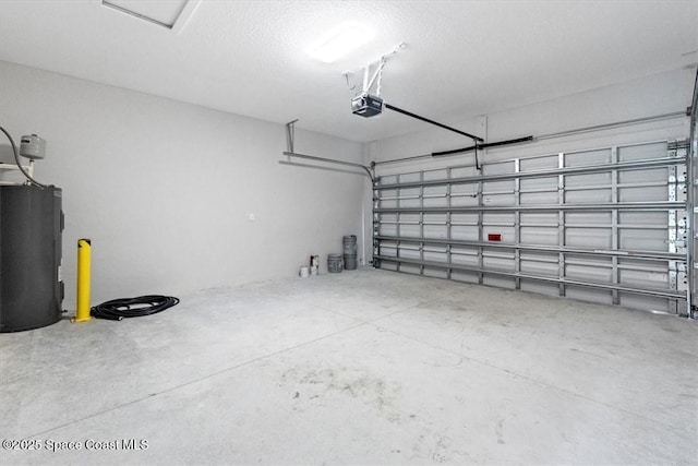 garage with water heater and a garage door opener