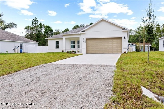 ranch-style house featuring fence, a front lawn, stucco siding, an attached garage, and concrete driveway