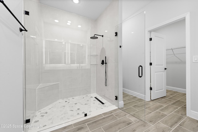 8276 100th Ave, Vero Beach, FL 32967 - full bath with a shower stall, a walk in closet, and recessed lighting