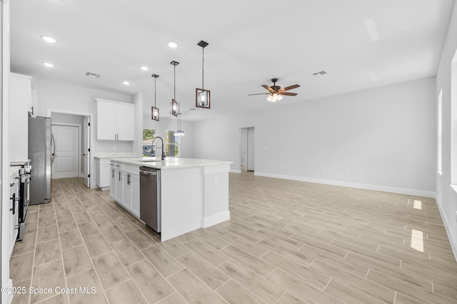 8276 100th Ave, Vero Beach, FL 32967 - kitchen featuring appliances with stainless steel finishes, recessed lighting, a ceiling fan, light countertops, and light wood-style flooring