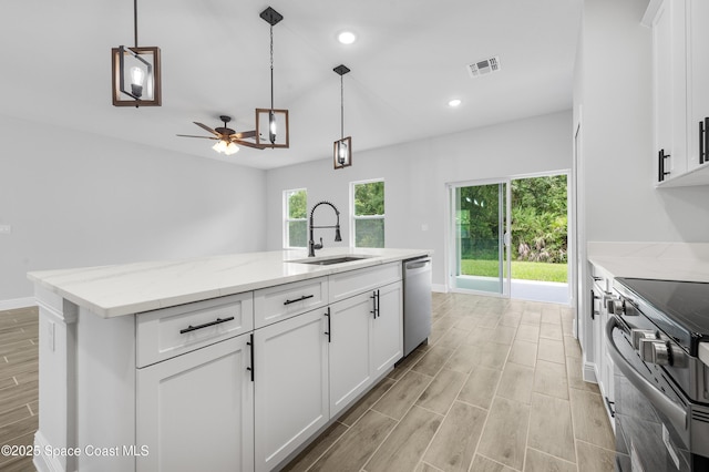 8276 100th Ave, Vero Beach, FL 32967 - kitchen with dishwasher, range, white cabinets, an island with sink, and a ceiling fan