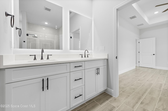 8276 100th Ave, Vero Beach, FL 32967 - full bath with double vanity, a shower stall, ceiling fan, and recessed lighting