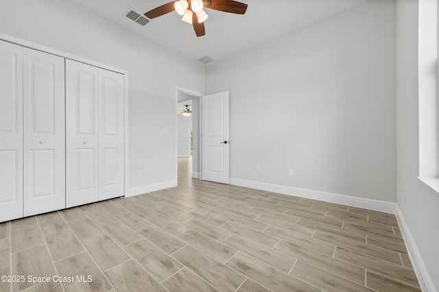 8276 100th Ave, Vero Beach, FL 32967 - unfurnished bedroom featuring a closet, light wood-style floors, and ceiling fan