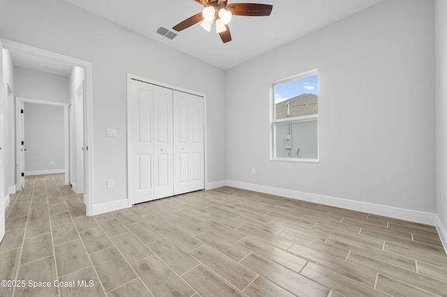 8276 100th Ave, Vero Beach, FL 32967 - unfurnished bedroom with light wood finished floors, a closet, and a ceiling fan