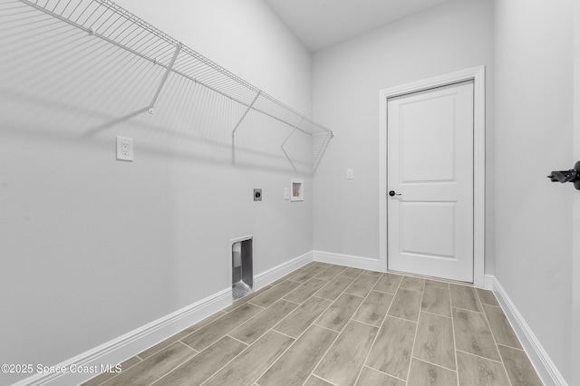 8276 100th Ave, Vero Beach, FL 32967 - washroom featuring washer hookup, wood tiled floors, and electric dryer hookup