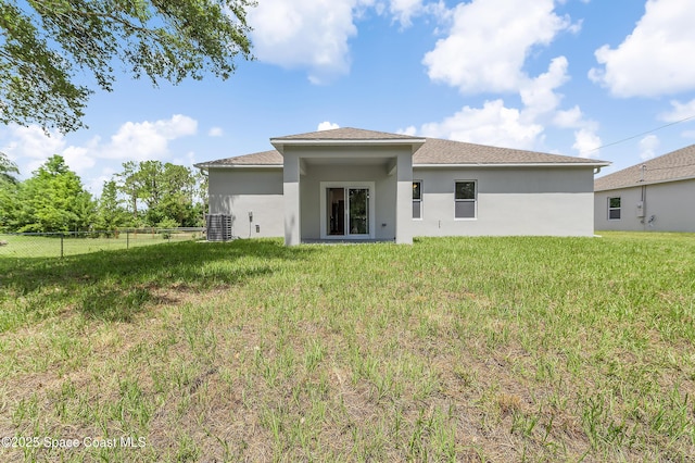 8276 100th Ave, Vero Beach, FL 32967 - rear view of property with stucco siding and roof with shingles