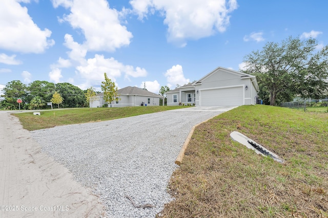 8276 100th Ave, Vero Beach, FL 32967 - ranch-style house with driveway, an attached garage, and a front lawn