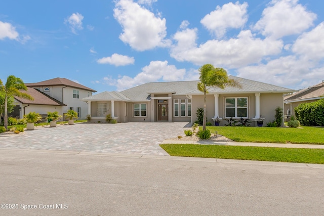 4117 Melrose Ct, Melbourne, FL 32940 - ranch-style home with stucco siding and a front lawn