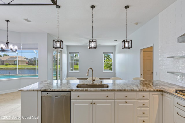 4117 Melrose Ct, Melbourne, FL 32940 - kitchen featuring light stone countertops, a sink, visible vents, white cabinets, and appliances with stainless steel finishes