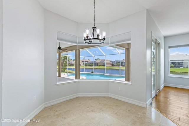 4117 Melrose Ct, Melbourne, FL 32940 - unfurnished dining area with baseboards, tile patterned floors, and ceiling fan with notable chandelier
