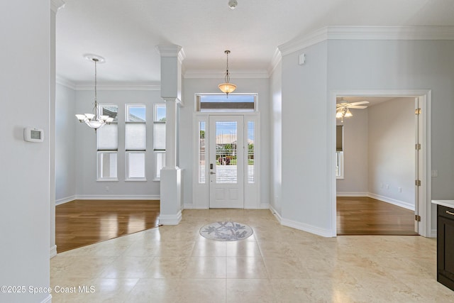 4117 Melrose Ct, Melbourne, FL 32940 - tiled foyer featuring ornamental molding, baseboards, ceiling fan with notable chandelier, and decorative columns
