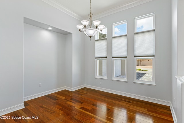 4117 Melrose Ct, Melbourne, FL 32940 - unfurnished dining area with ornamental molding, an inviting chandelier, baseboards, and dark wood-type flooring
